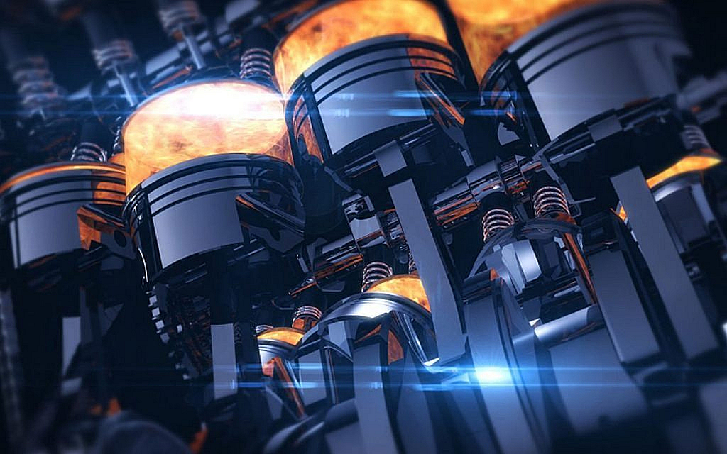 A stylised, close-up image of an engine's pistons with fiery combustion inside the cylinders.