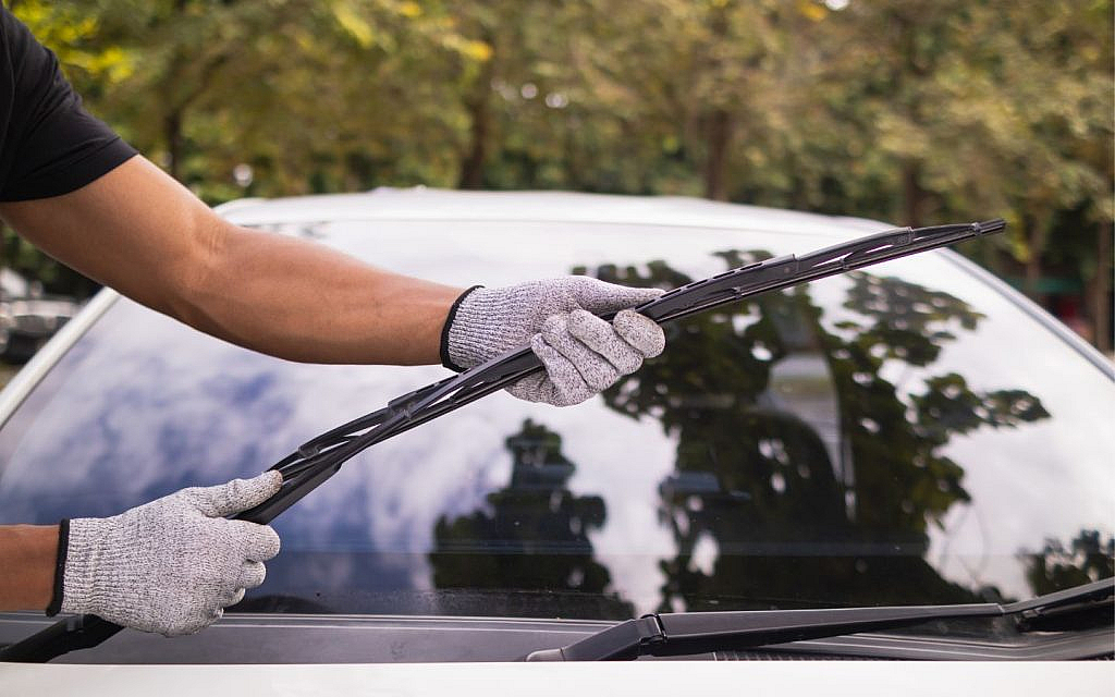 Replace worn wipers and clean windows to cut glare.