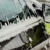 person cleaning car with two-bucket car washing method