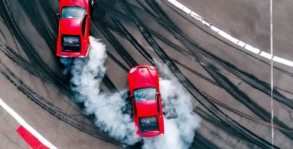 two red cars drifting