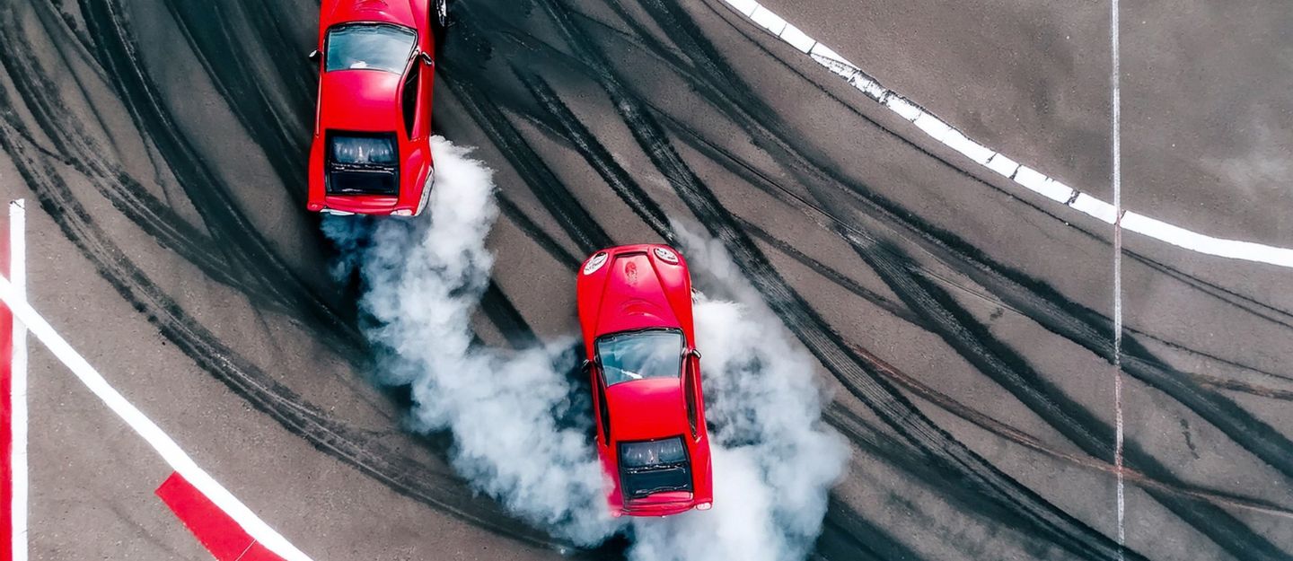two red cars drifting
