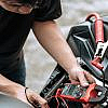 a person installing a motorcycle GPS tracker