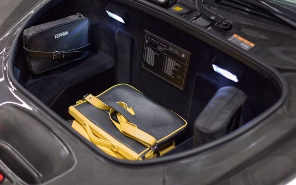Storing a bag in limited storage space of a sports car