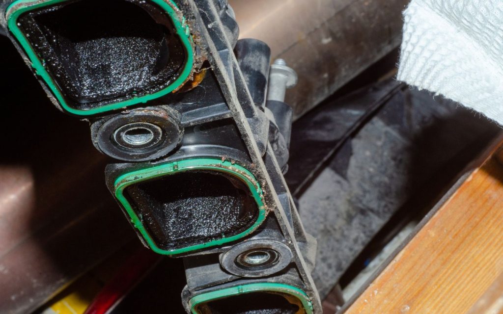 Oil buildup in the intake manifold can gradually restrict airflow