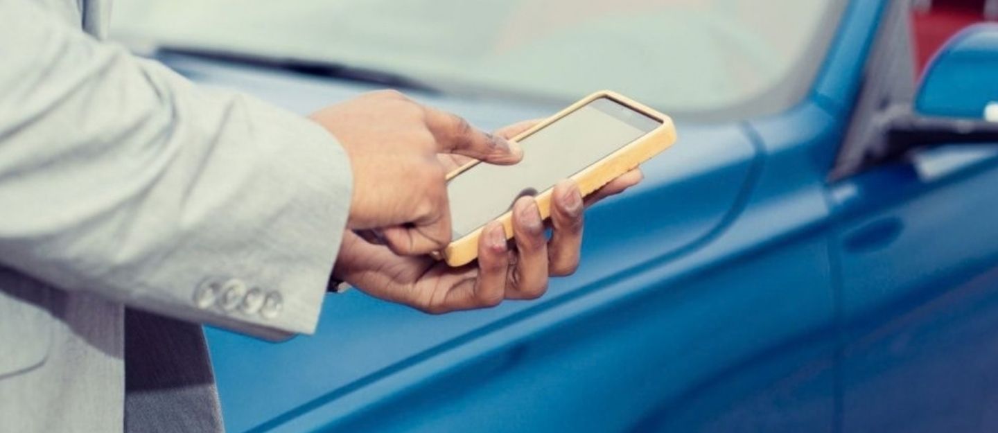 man using an app on phone