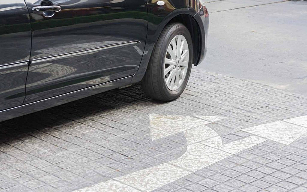 Road markings with a car stopped nearby