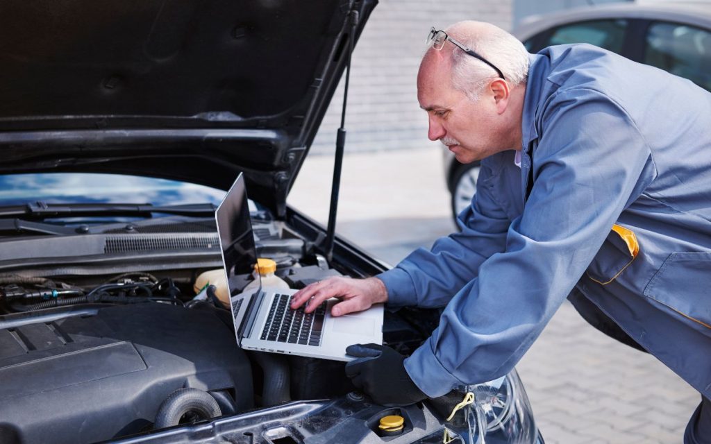 A mechanic checking an electric supercar