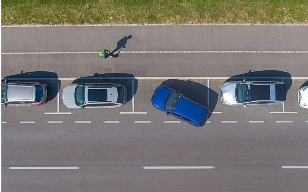 Driver manoeuvring a tight parking space