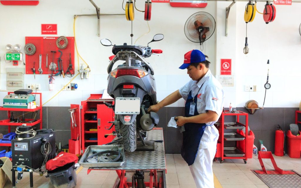 man in a motorbike repair shop Dubai