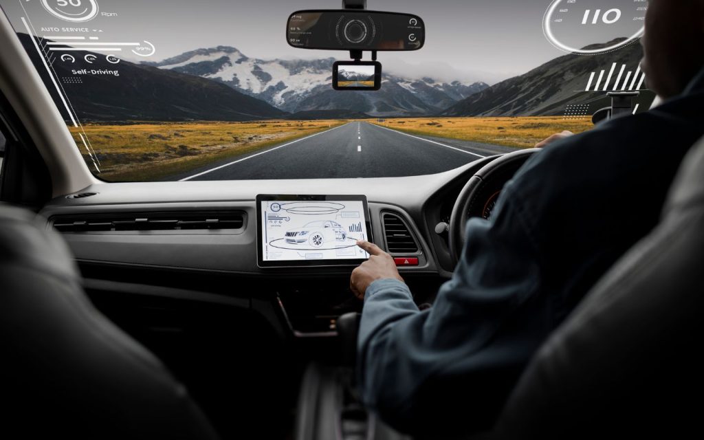 A driver selecting a destination on a navigation system