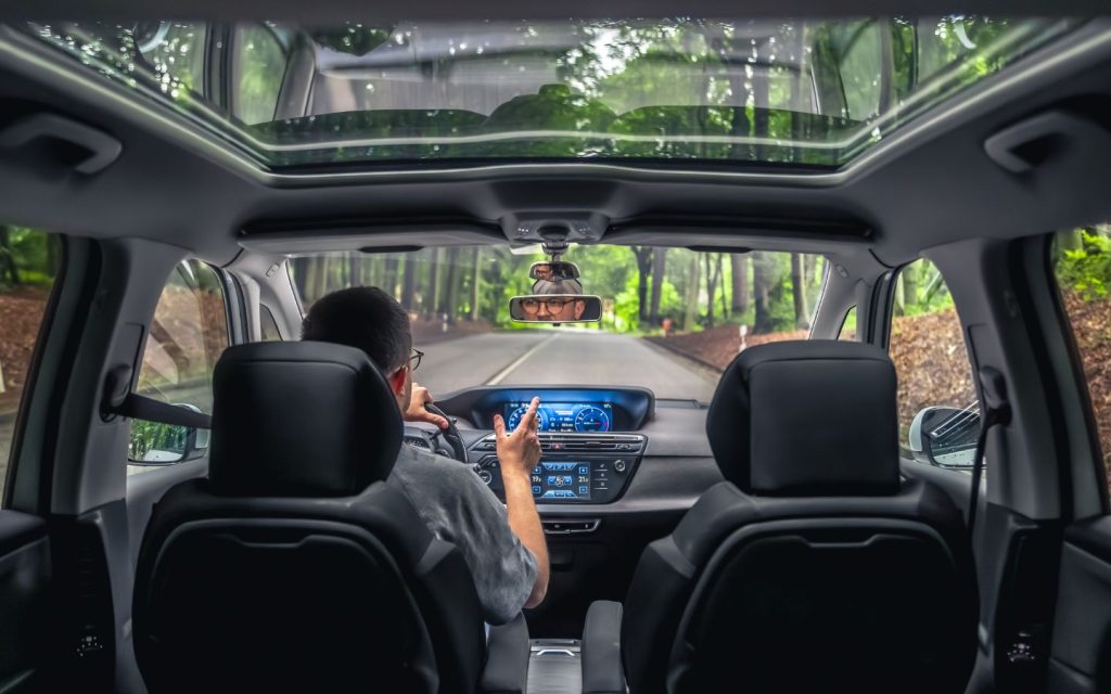 Interior view of a car travelling through the jungle