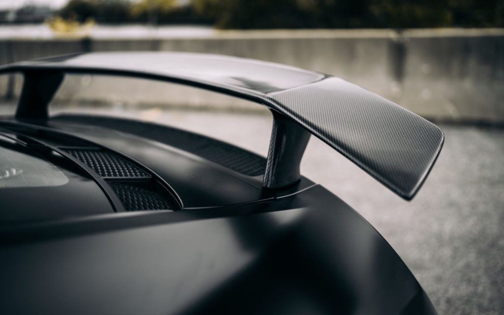 A detailed car spoiler and wing comparison