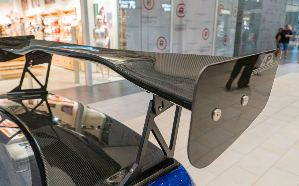 spoiler benefits for a car include reduced drag