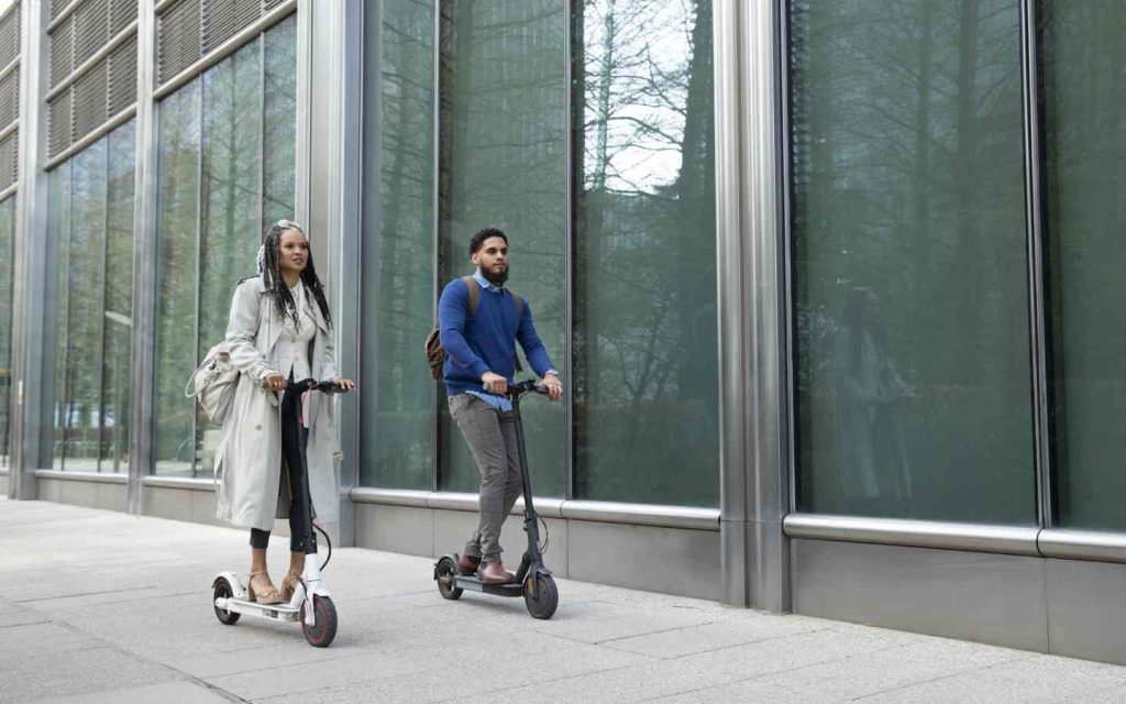people riding e-scooters