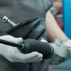 a man checking signs of rack and pinion steering replacement