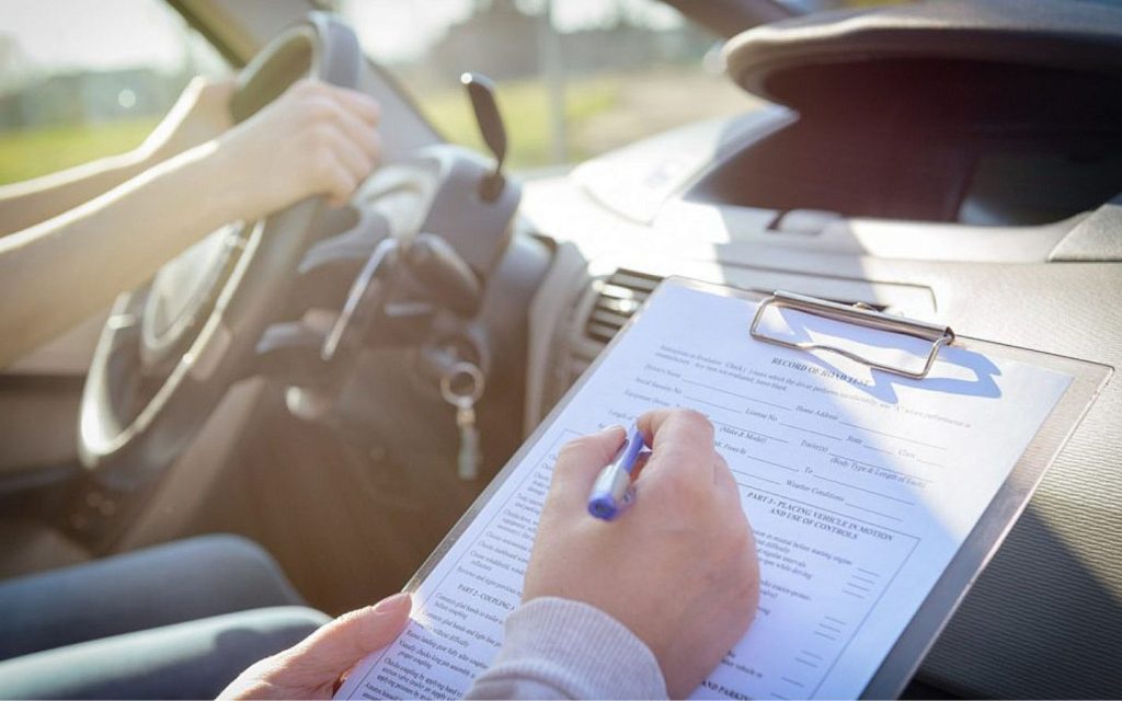 a person conducting a car inspection 