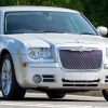 A 2008 silver Chrysler 300 car driving on the road. Image Credits: Shutterstock Contributor Sue Thatcher