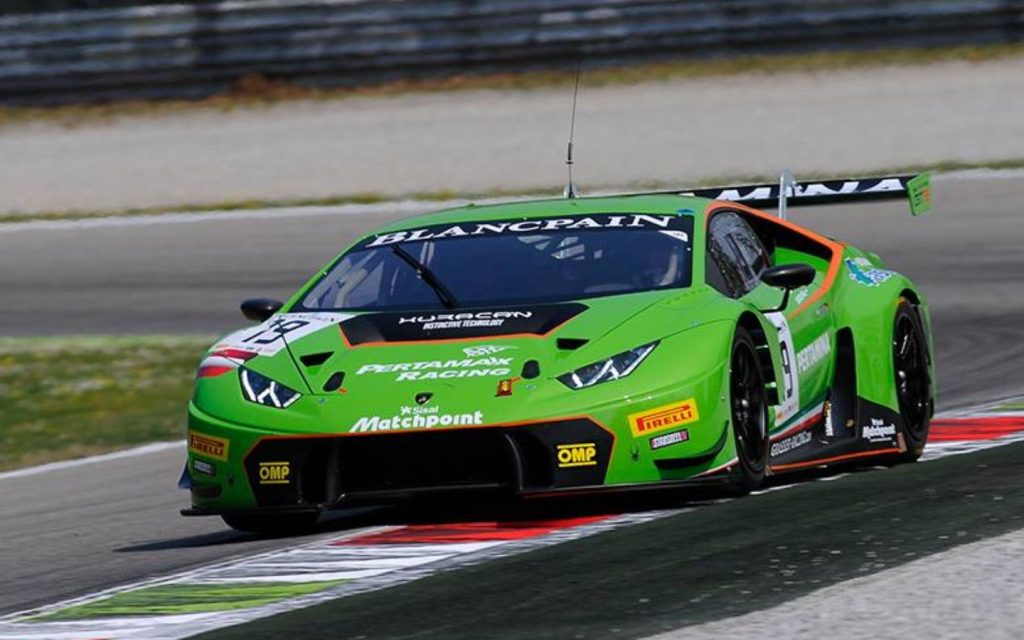 A vibrant green Lamborghini Huracán GT3 race car. 