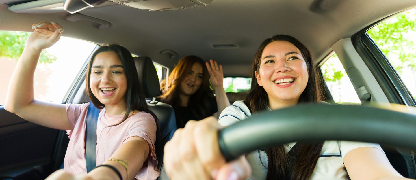 Group of girls enjoying a road trip