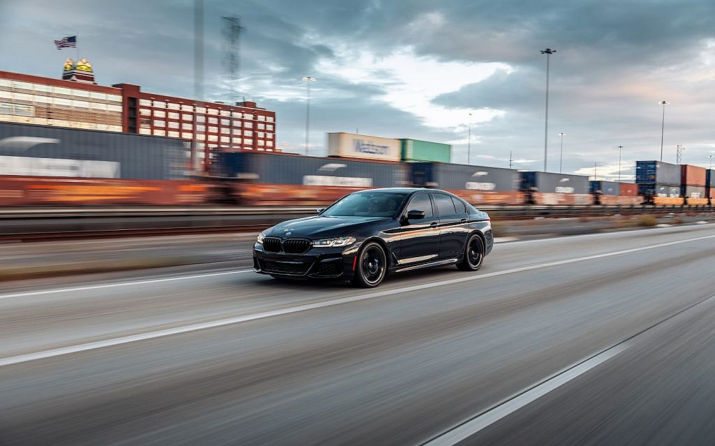BMW 5 Series driving on the road