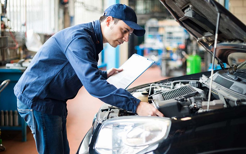a person is doing vehicle testing and inspection