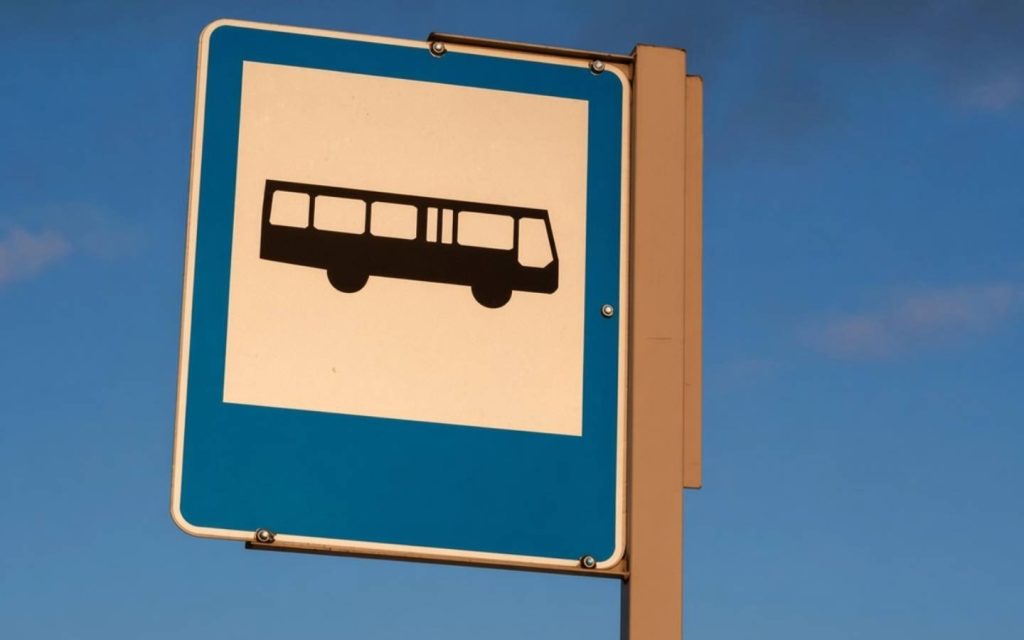A bus stop sign board