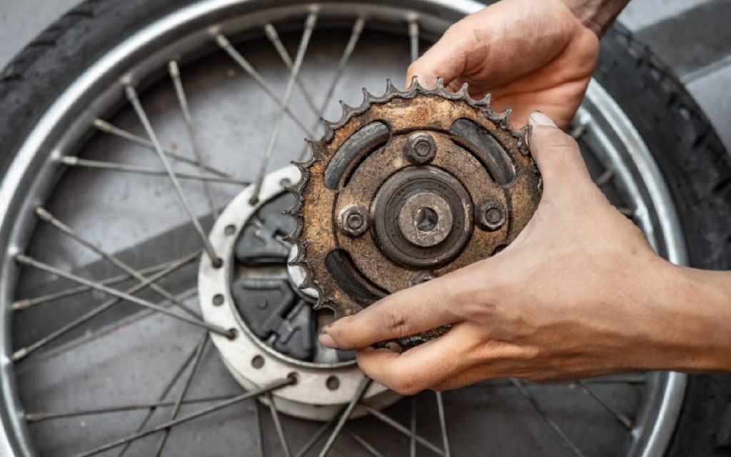 A worn-out and rusted motorcycle sprocket